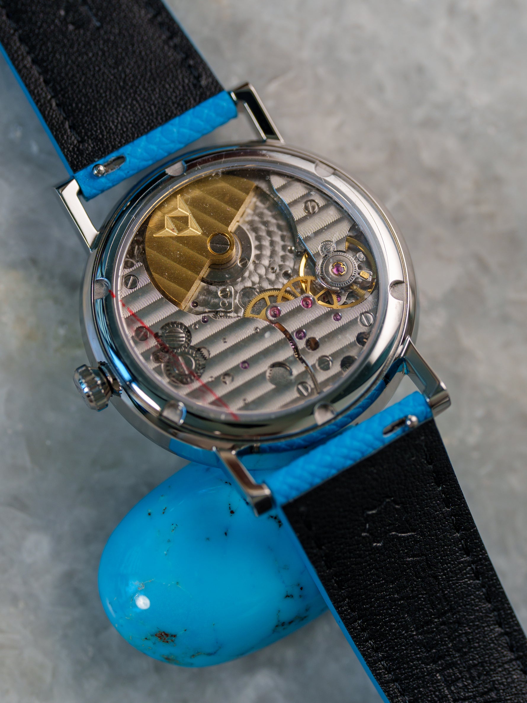 Automatic micro-rotor movement through the sapphire display caseback — Turquoise Purity | Smiths Boutique