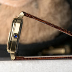 AV86 1954 Capri Vintage Cream/Gold — case profile with the synthetic sapphire cabochon crown