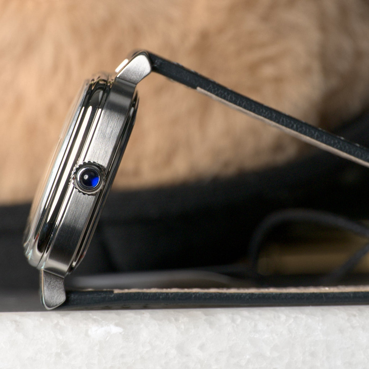 AV86 1954 Capri White/Steel — case profile with the synthetic sapphire cabochon crown